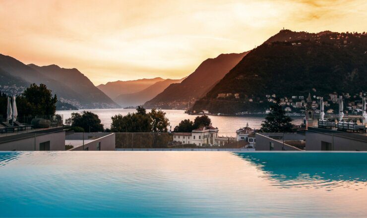 Image of the pool overlooking the lake como at sunset